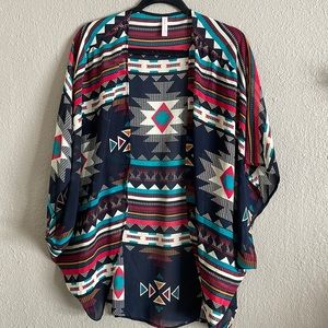 Light Aztec style cover over blouse